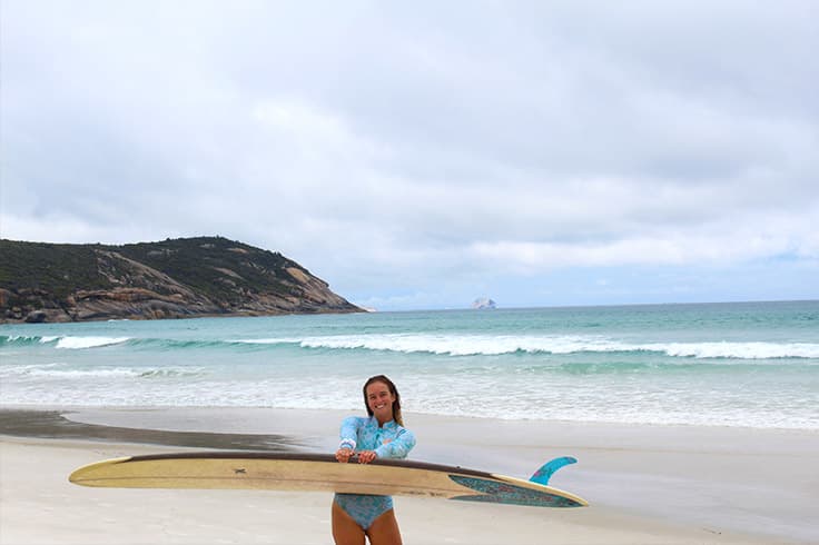 girl-at-squeaky-beach-with-surfboard girl-at-squeaky-beach-with-surfboard