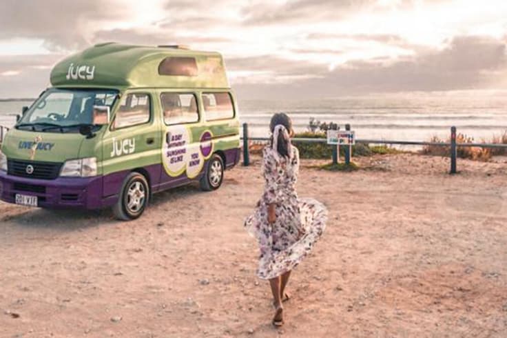 7 day road trip itinerary adelaide to melbourne 6 girl in sundress twirls in front of jucy vehicle