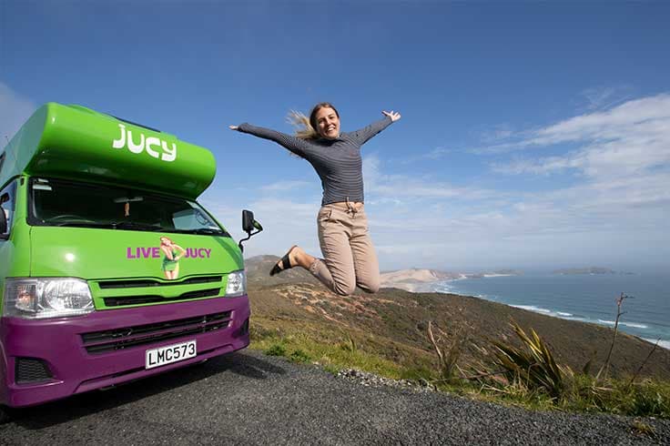 Cape Reinga lookout behind JUCY campervan Cape Reinga lookout behind JUCY campervan
