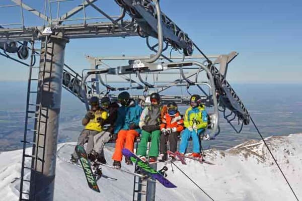 Group of friends on South Island ski lift Group of friends on South Island ski lift